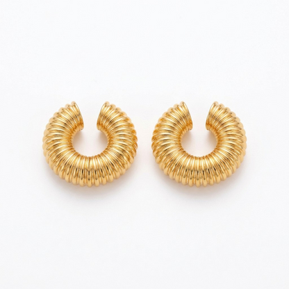 Tania Claire Australia gold-tone Nervure ear cuffs featuring a chunky, sculptural ribbed texture design.