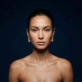Tania Claire Australia gold sunburst charm huggie hoop earrings with pavé detail.
