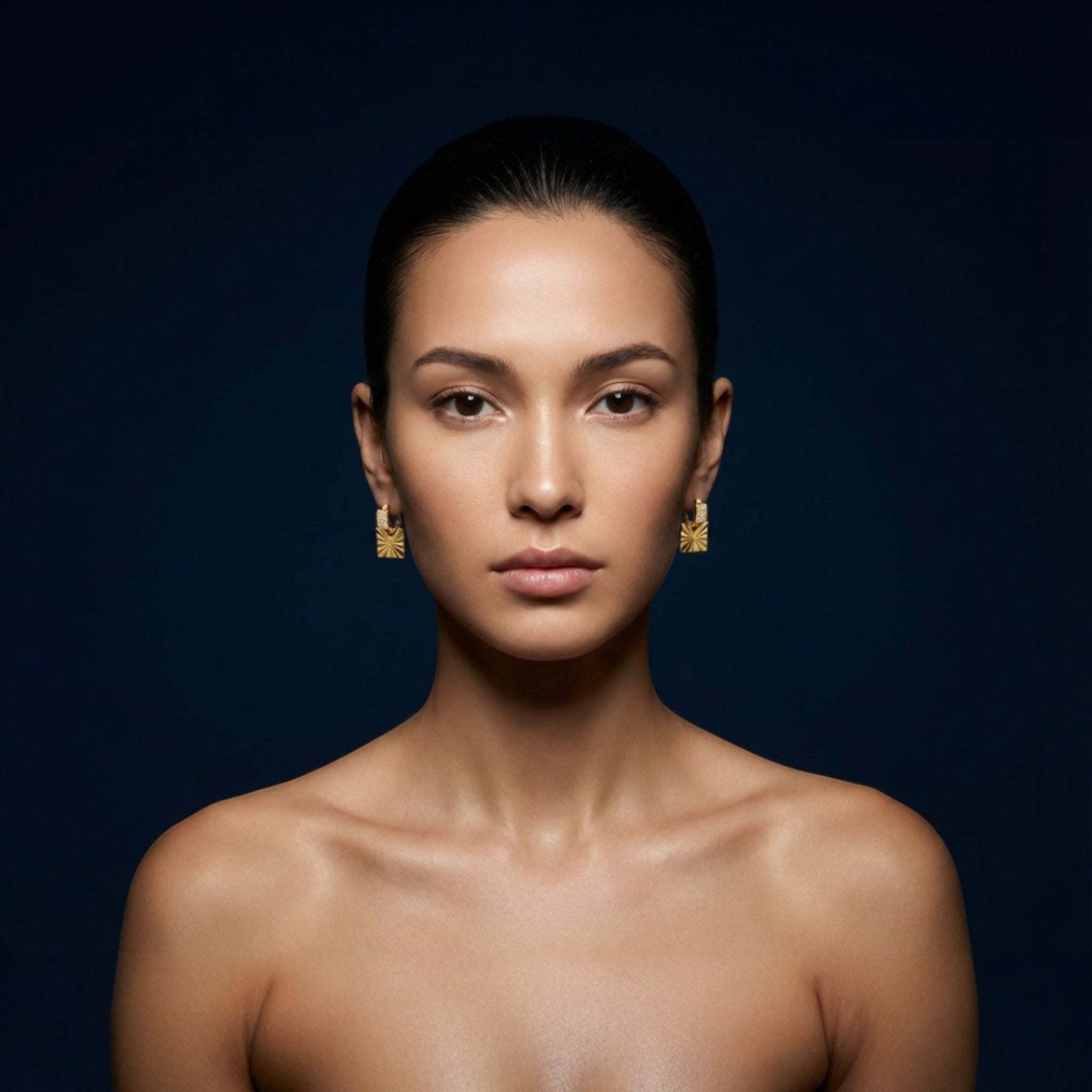 Tania Claire Australia gold sunburst charm huggie hoop earrings with pavé detail.