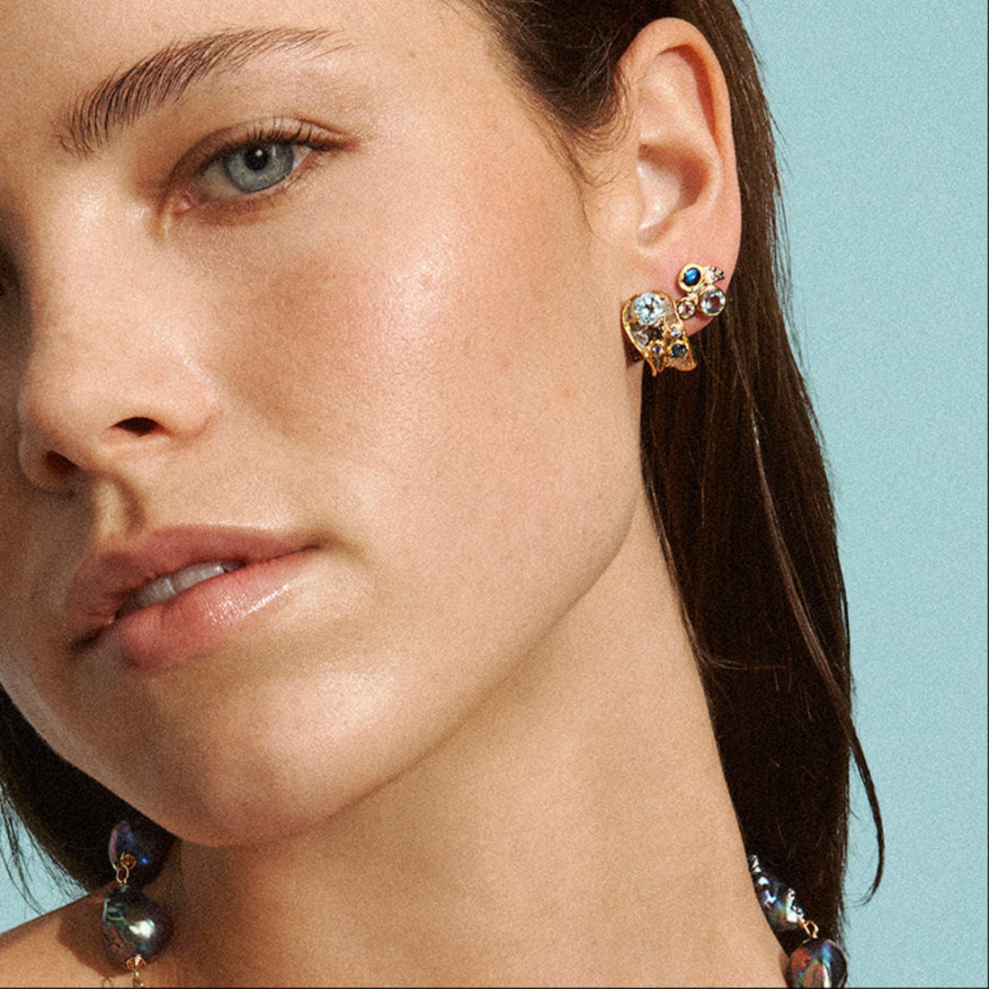 Tania Claire Australia gold plated sterling silver earrings with sky blue topaz, London blue topaz, and tanzanite.