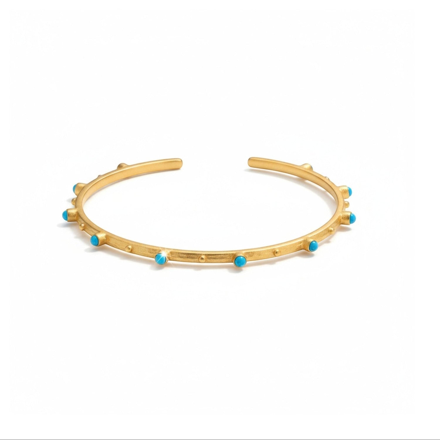 Tania Claire Australia gold-tone cuff bracelet with small turquoise stones and beaded accents, open design.