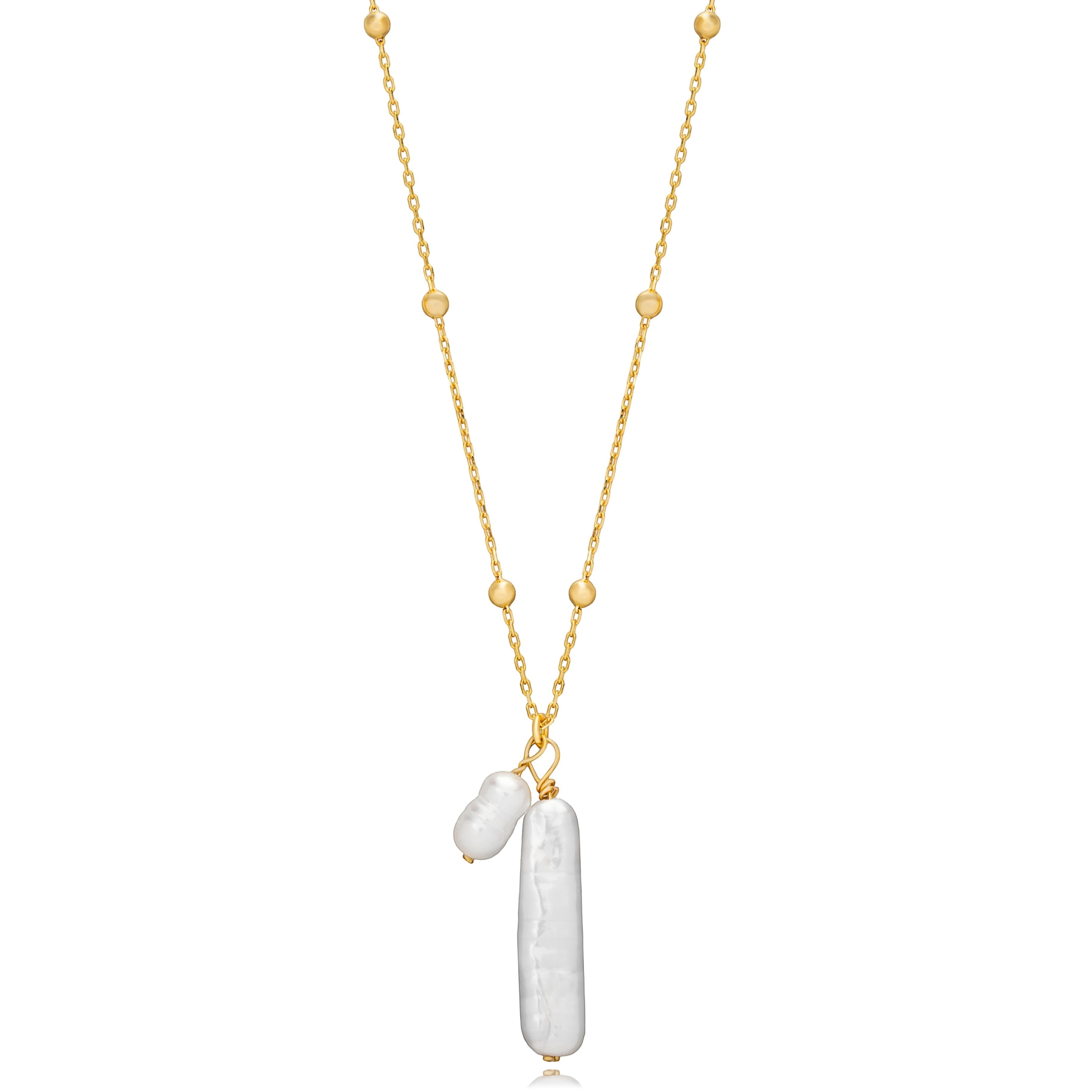 Tania Claire Australia gold vermeil necklace with two freshwater pearls, one elongated and one rounded, on a beaded chain.