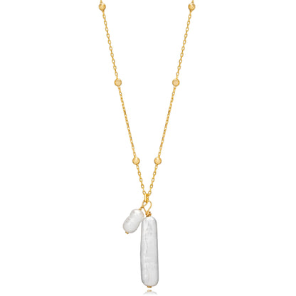 Tania Claire Australia gold vermeil necklace with two freshwater pearls, one elongated and one rounded, on a beaded chain.