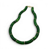 Tania Claire Australia Mia resin statement necklace featuring marbled green curved beads with gold-tone spacers.