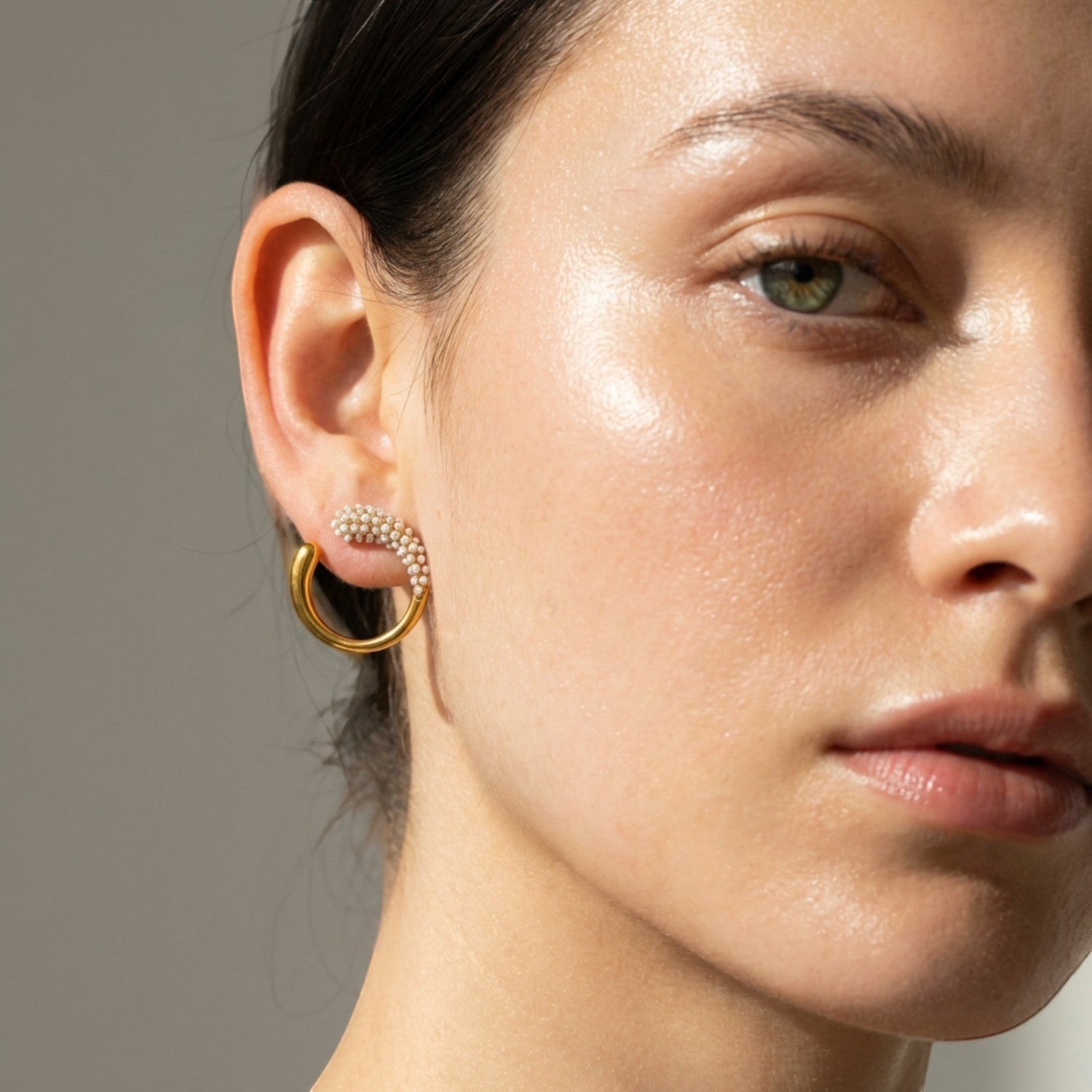 Tania Claire Australia Hera Hoops: twisted gold-plated stainless steel hoop earrings with pearl accents and stud closing.