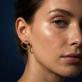 Tania Claire Australia Hera Pearl Hoops: gold-tone open hoop earrings with a curved design embellished with faux pearls.