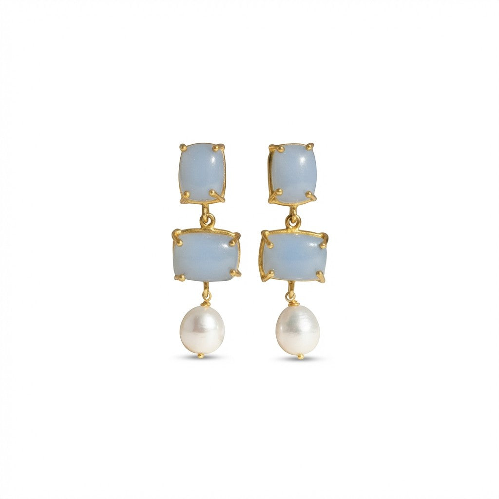 Tania Claire Australia Iris drop earrings with blue gemstones and white baroque pearls in 24k gold-plated brass.
