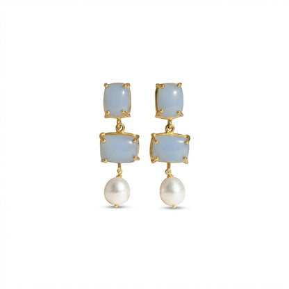 Tania Claire Australia Iris drop earrings with blue gemstones and white baroque pearls in 24k gold-plated brass.