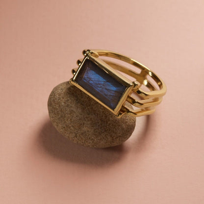 Tania Claire Australia Storm Bound ring with rectangular labradorite stone and 18K gold bands. Sterling silver.