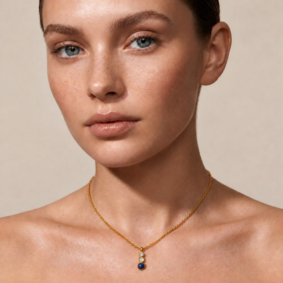 Tania Claire Australia Waymark Cairn drop necklace featuring a Lapis, Moonstone, and Peridot pendant on a gold chain.