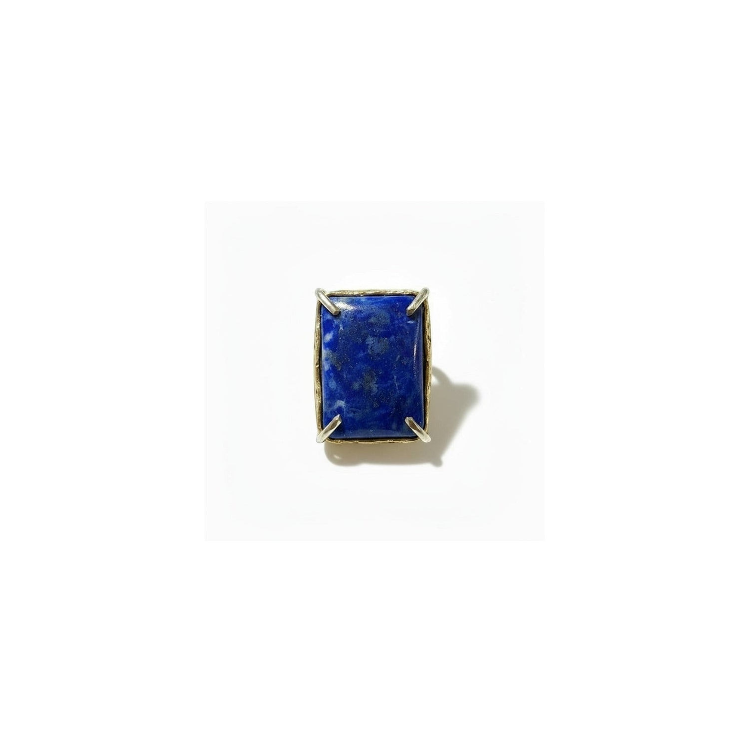 Tania Claire Australia gold-plated brass ring with a rectangular, cabochon-cut lapis lazuli gemstone.
