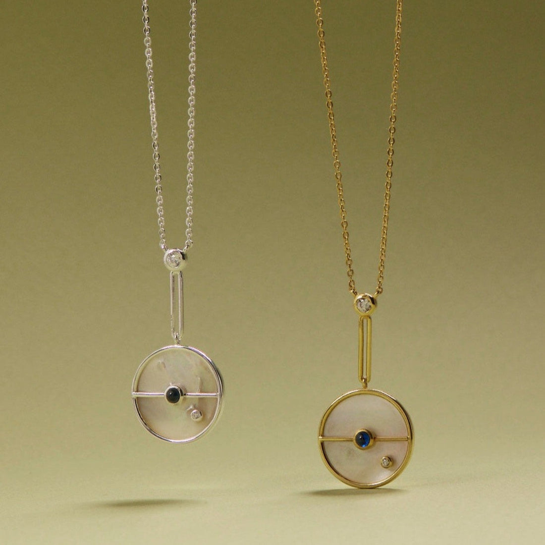 Tania Claire Australia Lunar Orbit Necklace: 14K gold, mother-of-pearl disc, sapphire, diamond accent. Elegant celestial design.
