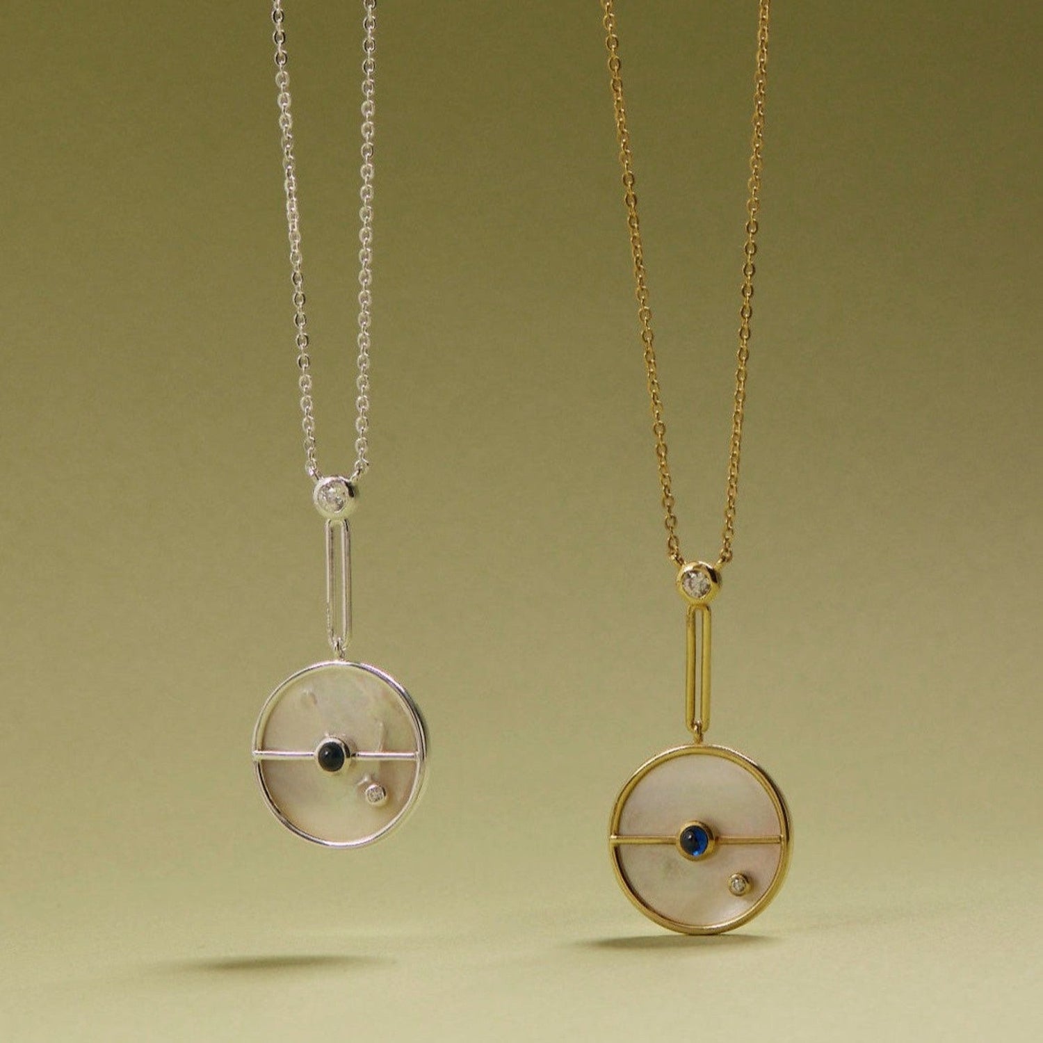 Tania Claire Australia Lunar Orbit Necklace: 14K gold, mother-of-pearl disc, sapphire, diamond accent. Elegant celestial design.