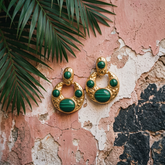 Tania Claire Australia hammered gold crescent hoop earrings with banded green malachite cabochon stones.