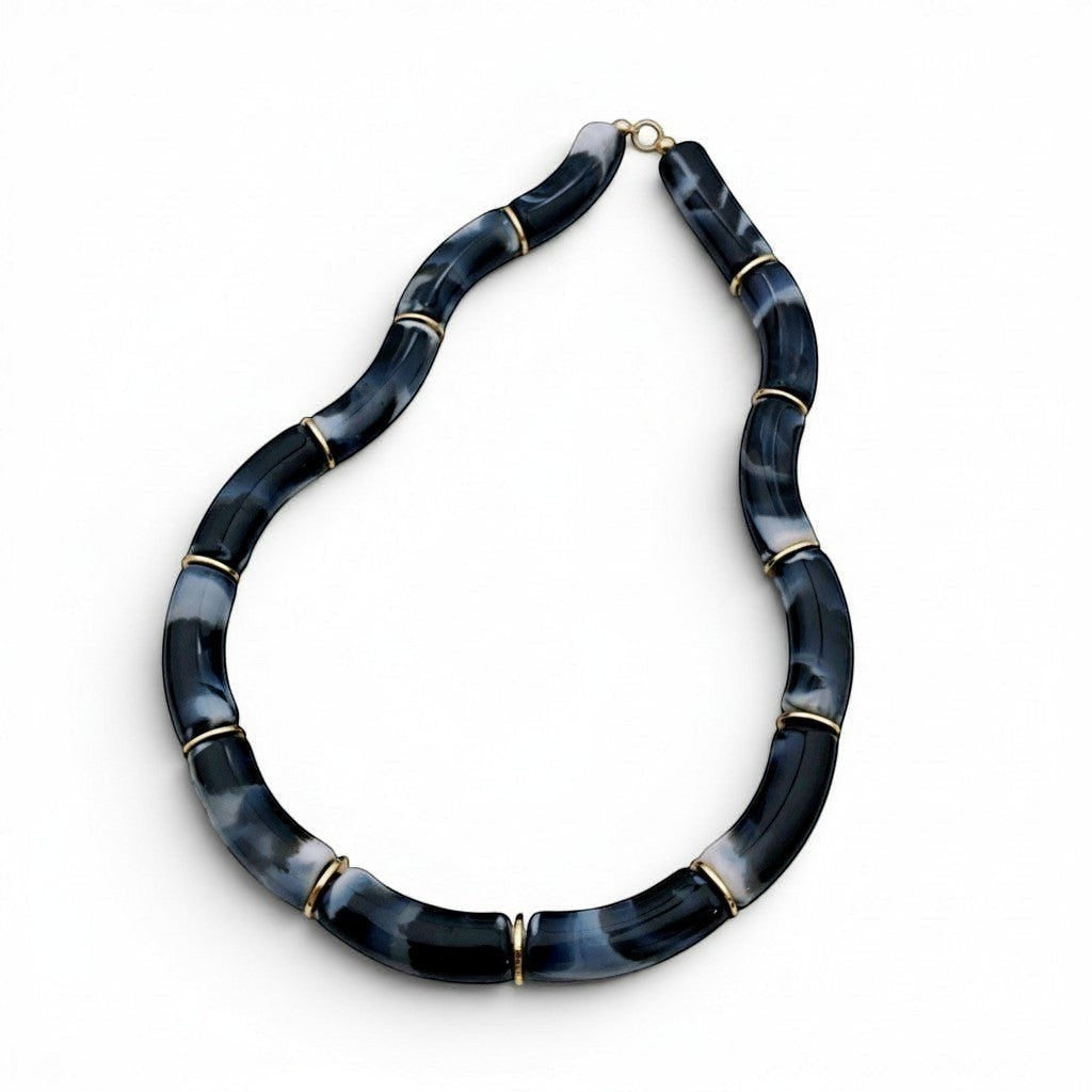 Tania Claire Australia Mia resin statement necklace with marbled black and white beads and gold-tone spacers.