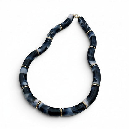 Tania Claire Australia Mia resin statement necklace with marbled black and white beads and gold-tone spacers.