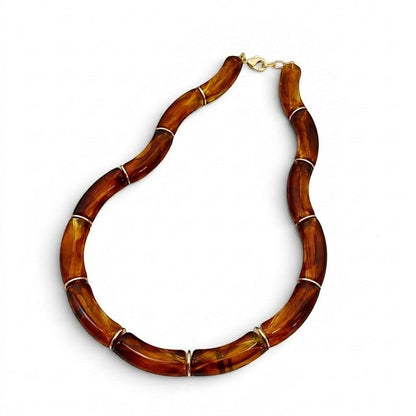Tania Claire Australia Mia resin statement necklace featuring marbled brown beads with gold-tone spacers.