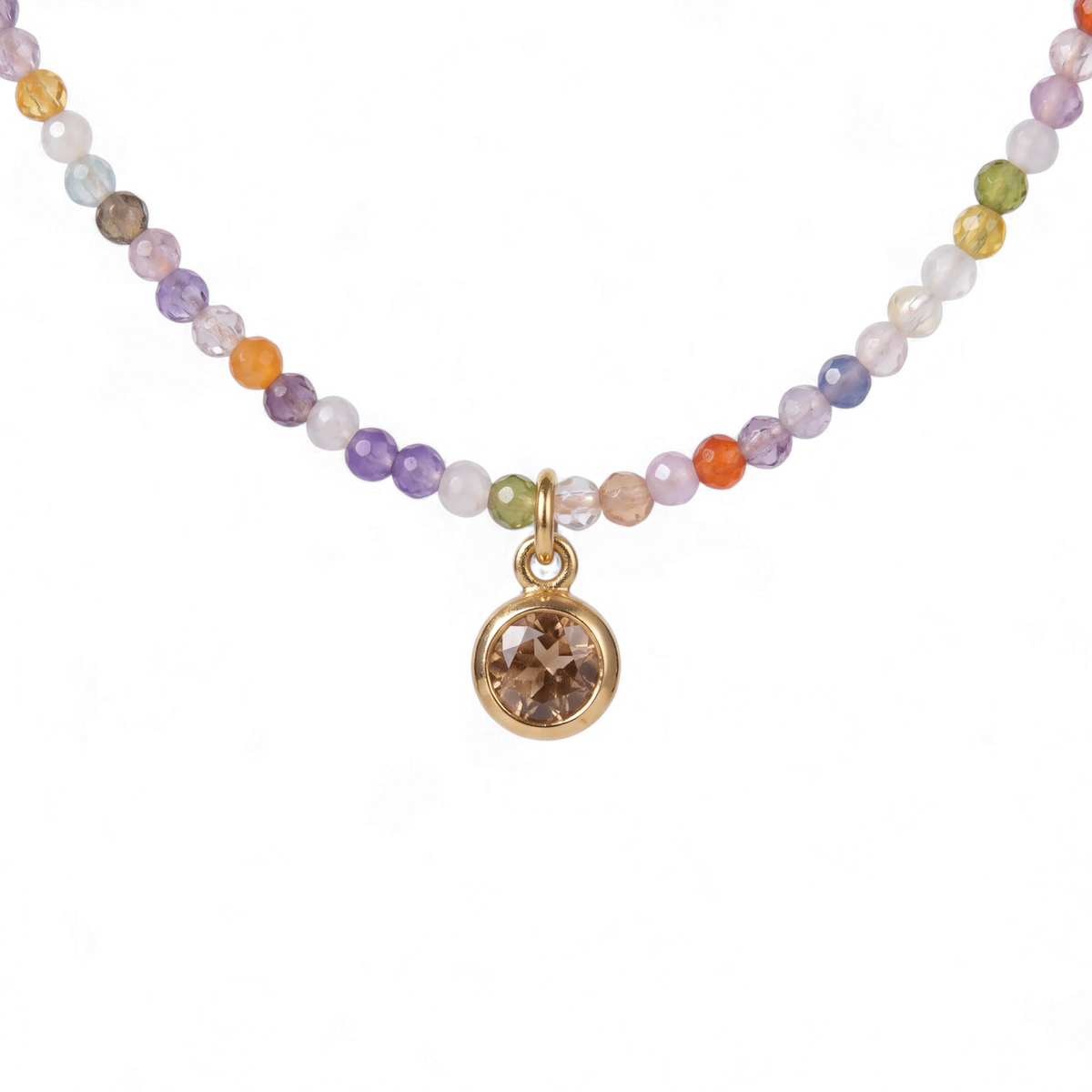 Tania Claire Australia Prism Bloom necklace featuring multicoloured beads and a petite gold-toned round pendant.