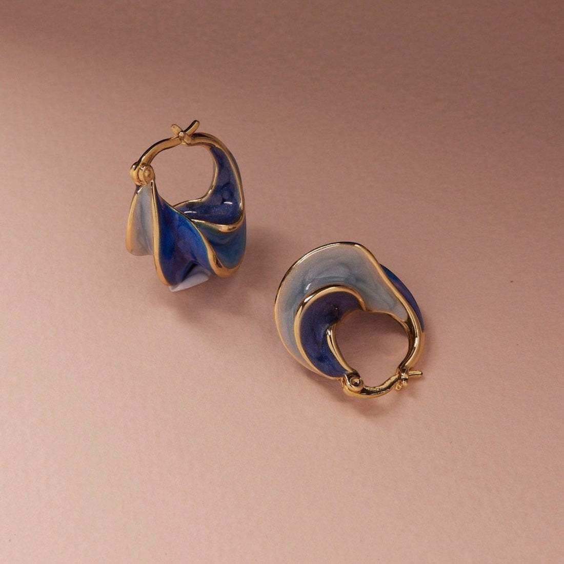 Tania Claire Australia Nerissa gold hoop earrings with swirling blue enamel, 23mm x 13mm.