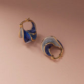 Tania Claire Australia Nerissa gold hoop earrings with swirling blue enamel, 23mm x 13mm.
