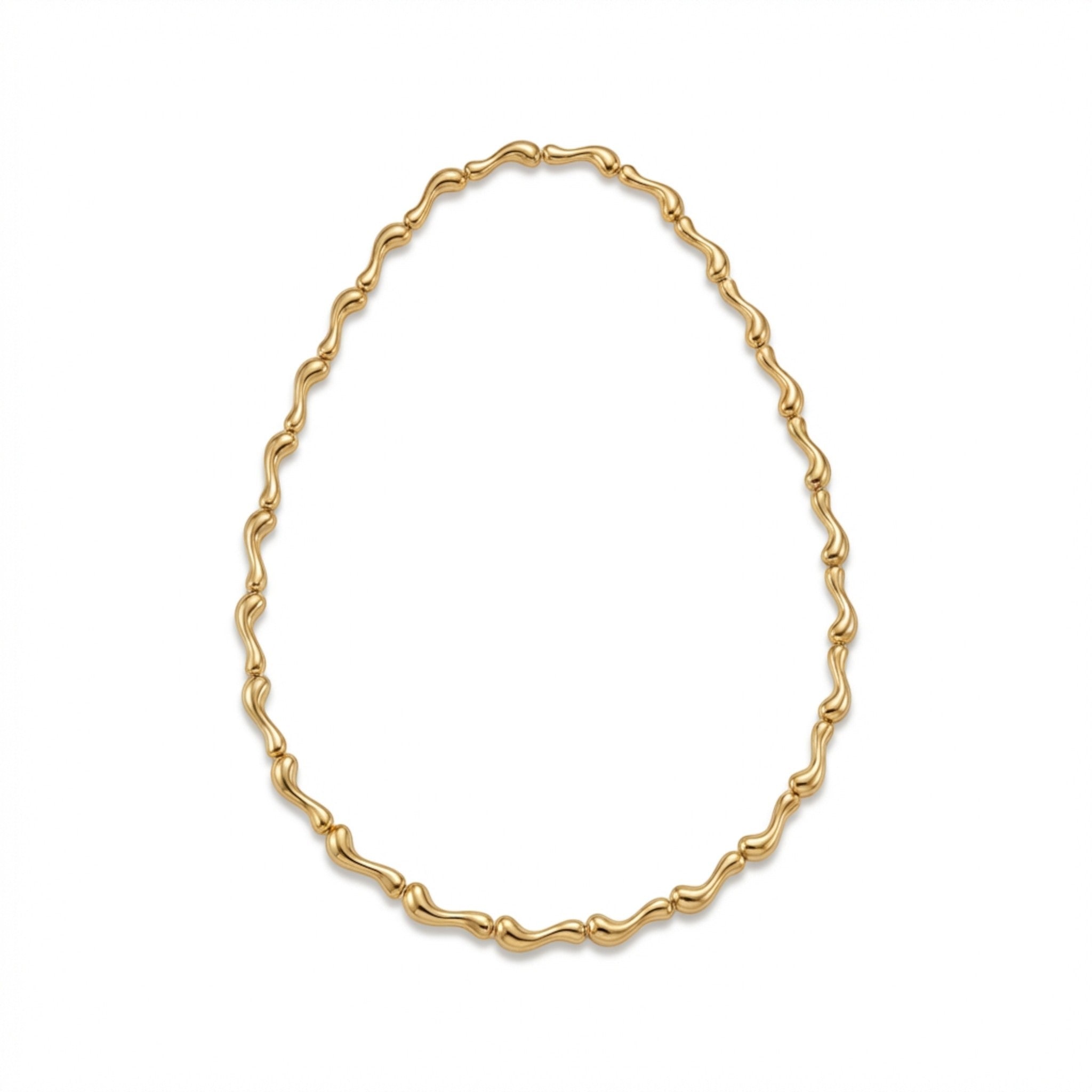 Tania Claire Australia Ocean Spine Necklace in 18K gold plating, featuring sculpted wave-like links for a fluid silhouette.