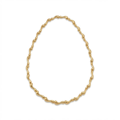 Tania Claire Australia Ocean Spine Necklace in 18K gold plating, featuring sculpted wave-like links for a fluid silhouette.