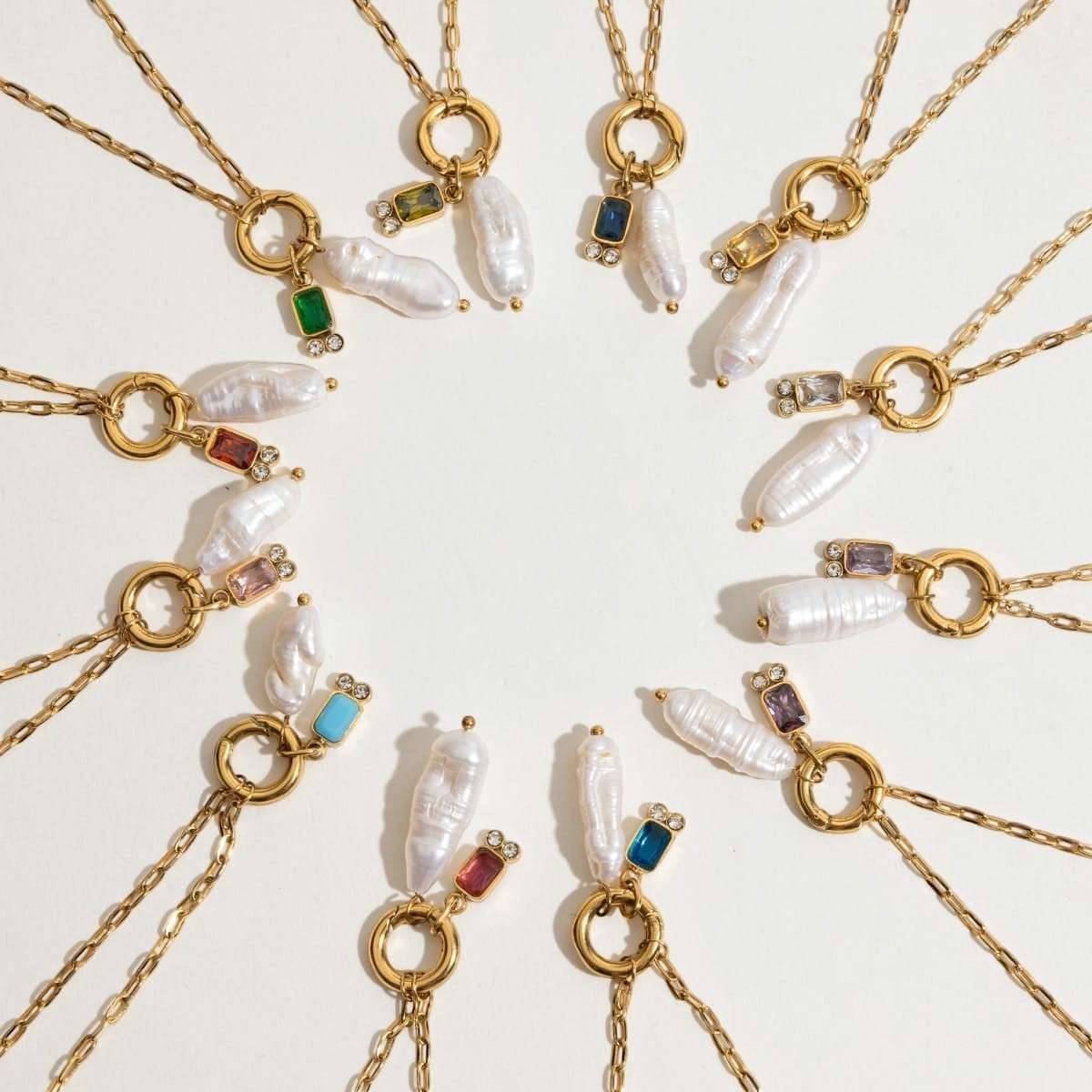Tania Claire Australia gold plated stainless steel necklaces featuring lustrous baroque pearls and birthstone charms.
