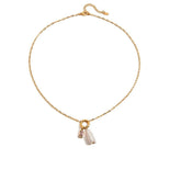 Tania Claire Australia gold-plated stainless steel necklace featuring a lustrous pearl and a pink birthstone charm.