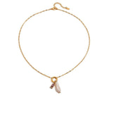 Tania Claire Australia gold plated stainless steel necklace featuring a lustrous pearl and purple birthstone charm.