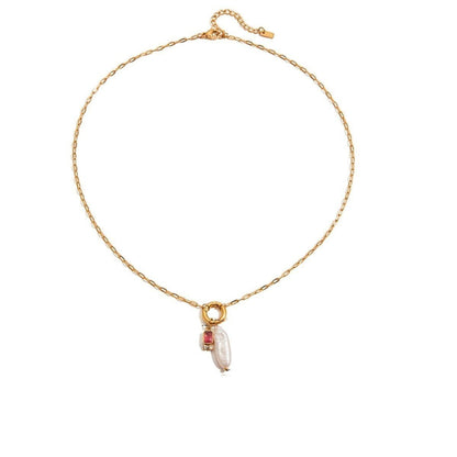 Tania Claire Australia gold plated stainless steel necklace featuring a lustrous pearl and a red birthstone charm.