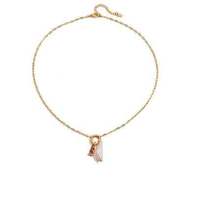 Tania Claire Australia gold plated stainless steel necklace featuring a lustrous pearl and a red birthstone charm.