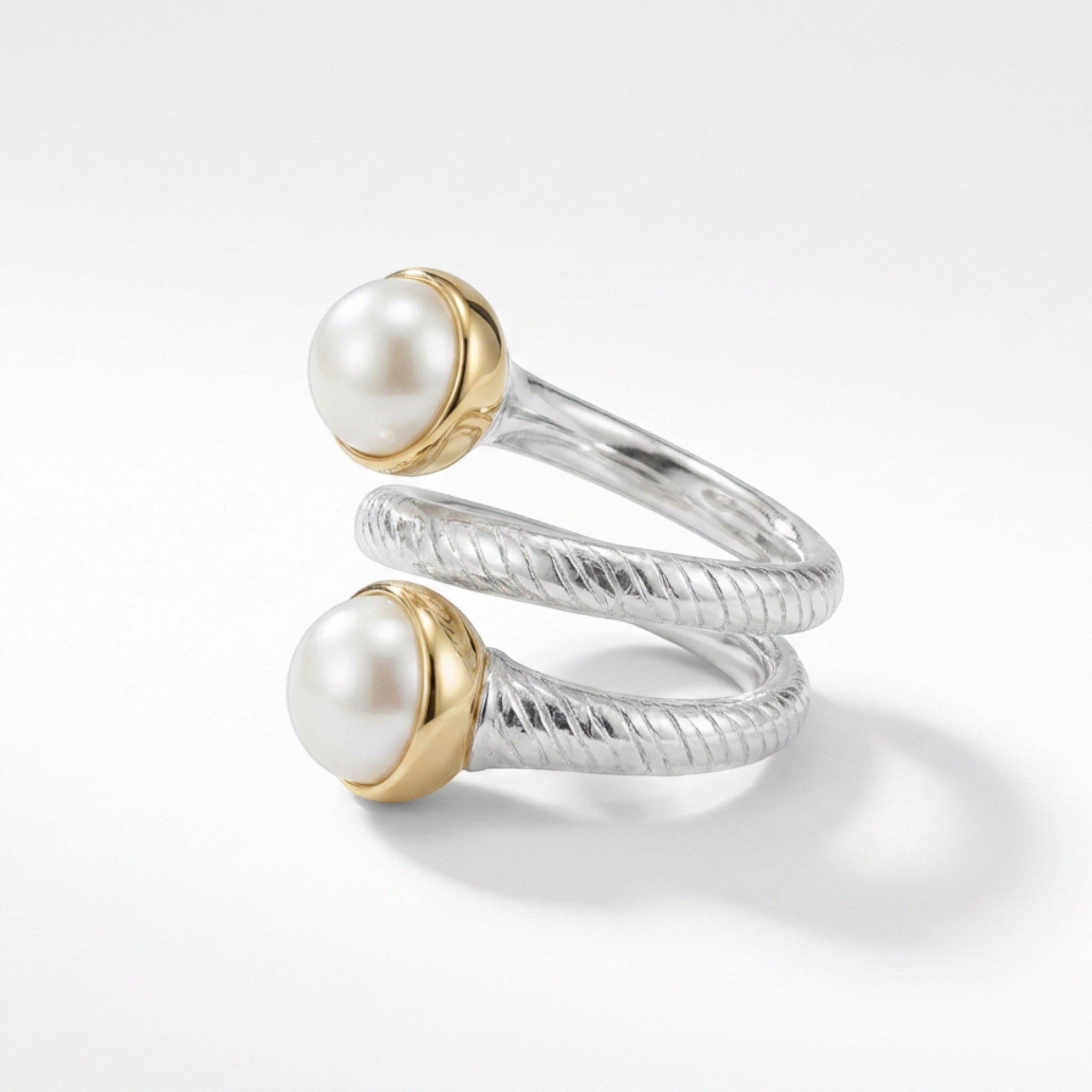 Tania Claire Australia Luna Coil Ring: sterling silver spiral ring with textured finish, accented by two pearls in gold bezels.