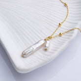 Tania Claire Australia Tidal Whispers necklace with two freshwater pearls on a beaded 18K gold vermeil chain.