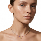 Tania Claire Australia Prism Bloom necklace with multicoloured beads and a petite gold-toned pendant on a model
