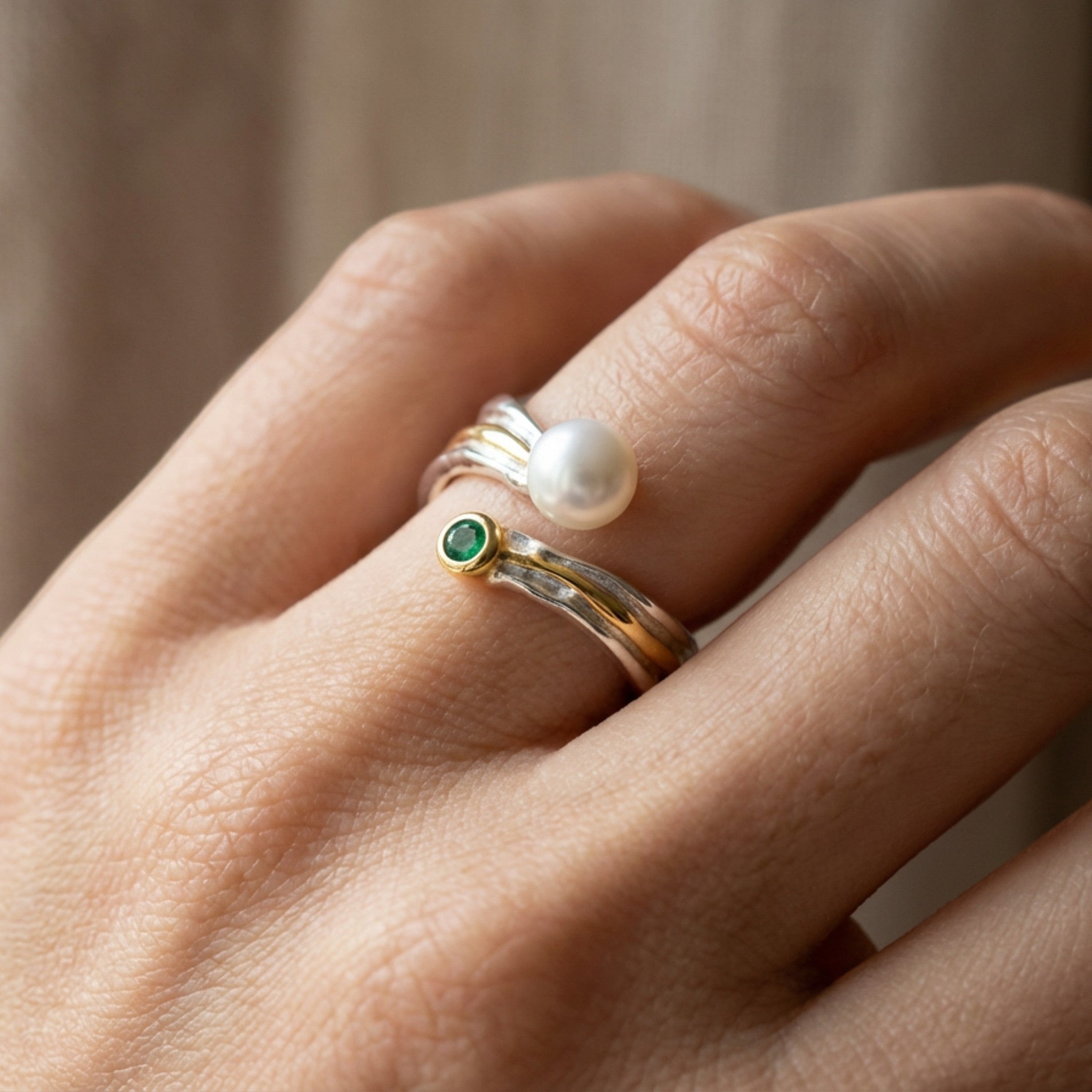 Tania Claire Australia Riverstone Ring: sterling silver band with pearl and emerald accents, gold detailing.