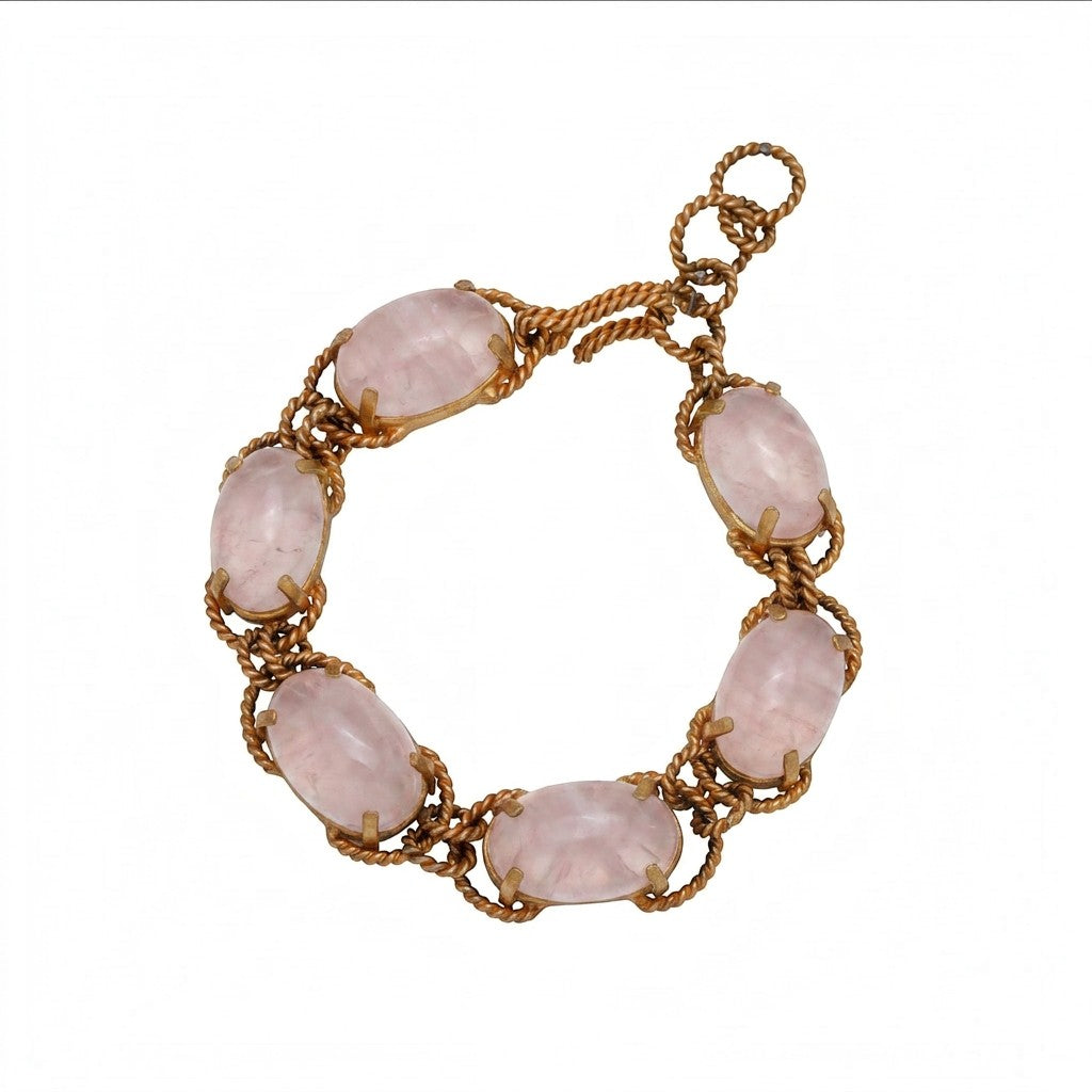 Tania Claire Australia gold-plated twist bracelet featuring oval cabochon rose quartz gemstones.
