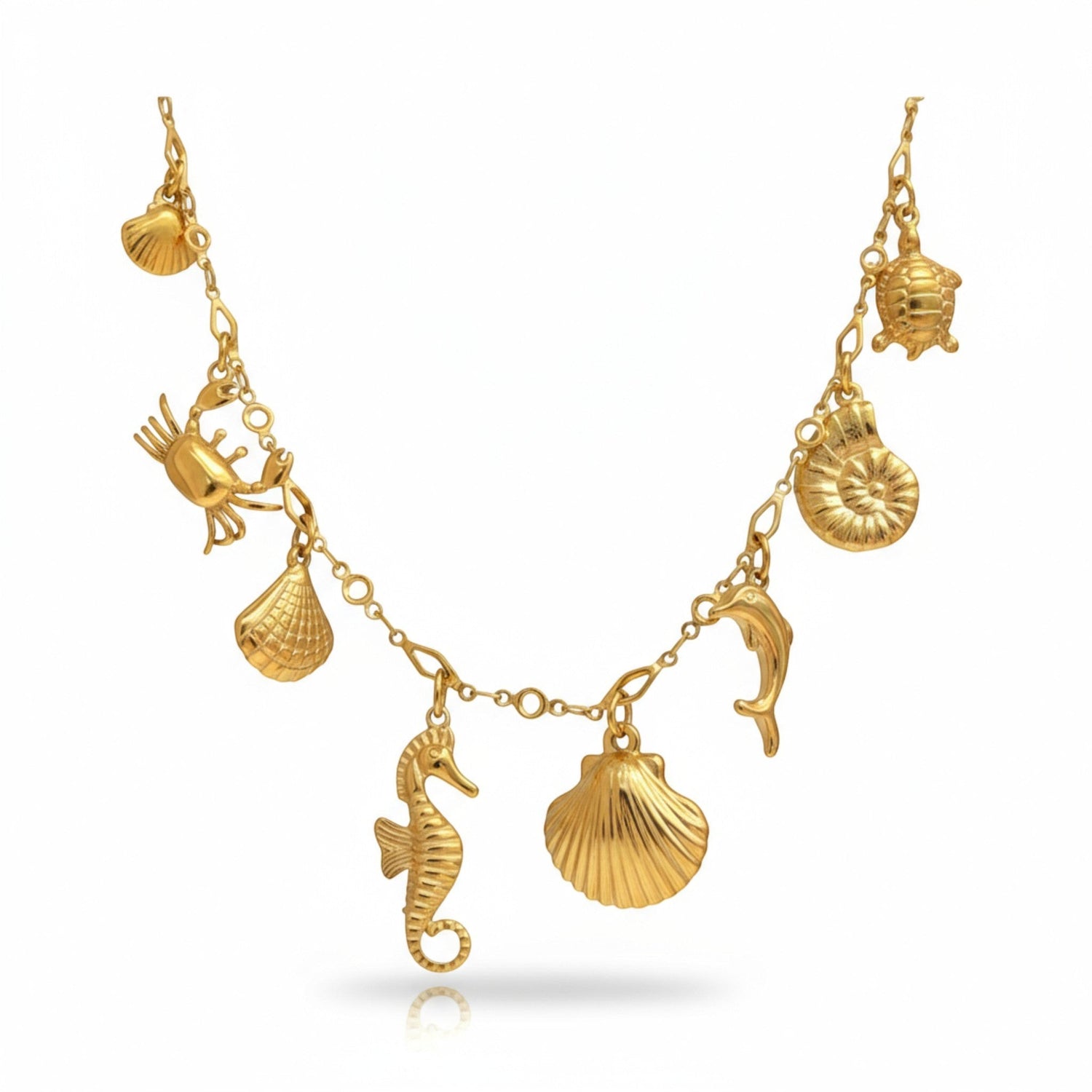 Tania Claire Australia gold plated sterling silver charm necklace with seahorse, dolphin, crab, shells, and turtle.