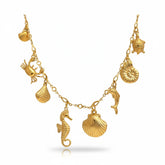 Tania Claire Australia gold plated sterling silver charm necklace with seahorse, dolphin, crab, shells, and turtle.