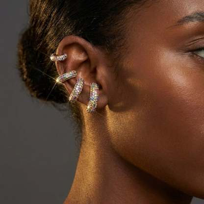 Tania Claire Australia Selene ear cuff stack featuring triple-wrap pavé crystals in a sculptural arc on a model ear.