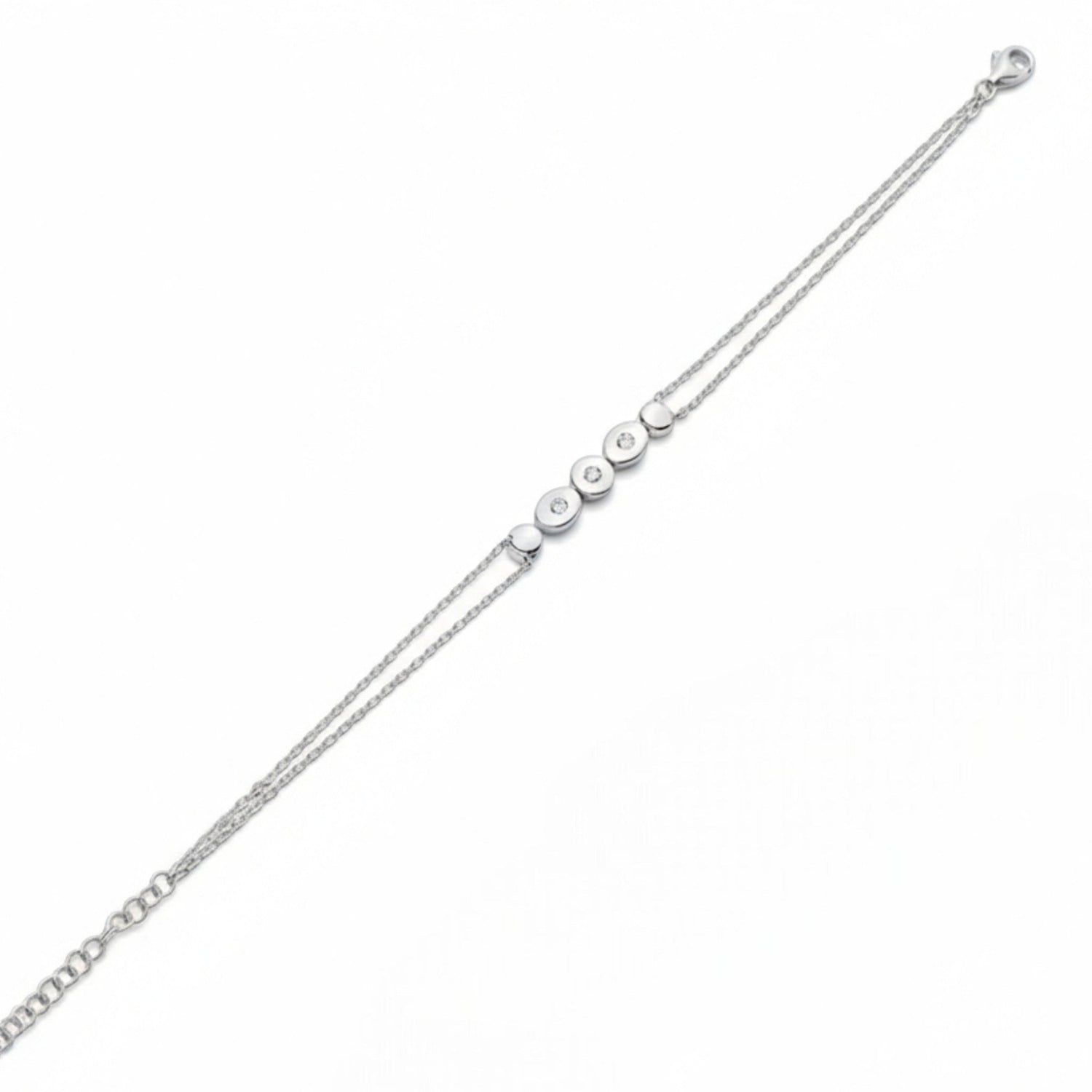 Tania Claire Australia silver bracelet with double chain and five circular charms, three with sparkling stones.