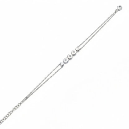 Tania Claire Australia silver bracelet with double chain and five circular charms, three with sparkling stones.