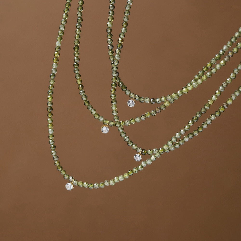 Tania Claire Australia Sophia necklace featuring faceted olive green crystal beads and small clear crystal pendants
