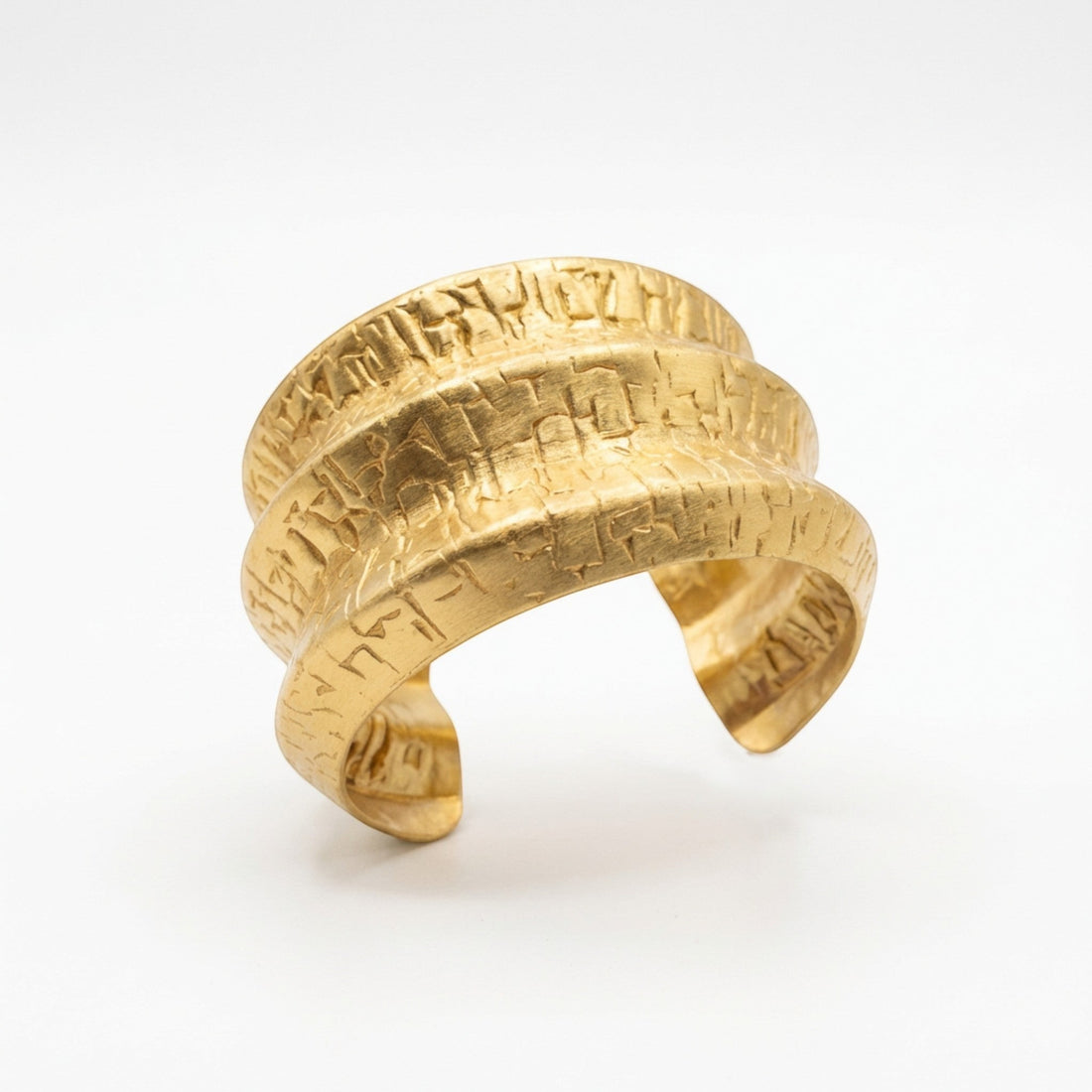 Tania Claire Australia Terra Script Cuff, a gold-tone adjustable cuff with a textured, layered sculptural band design.