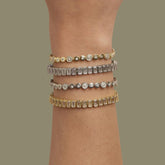 Tania Claire Australia Valentina tennis bracelet with emerald-cut crystals in sterling silver and 14K gold plating.