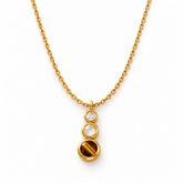Tania Claire Australia Waymark Cairn drop necklace featuring a crystal, rose quartz, and tiger eye in gold bezels.