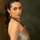 Tania Claire Australia gold-tone winged bird earrings with black baroque pearl drops. Sculptural drop design.