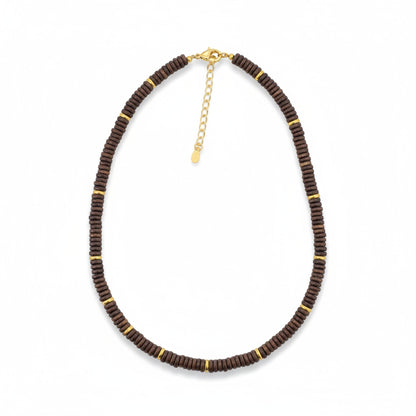 Tania Claire Australia dark brown wood bead necklace with gold accents and extender chain.