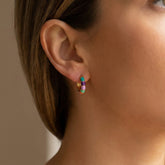 Tania Claire Australia gold-plated brass hoop earrings with colourful teal, violet, blush, and orange enamel segments.