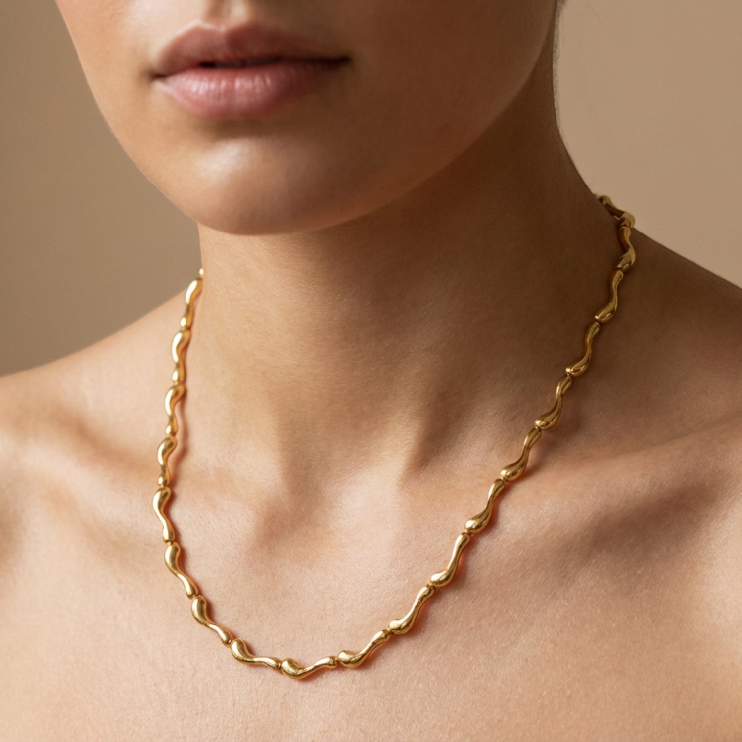 Tania Claire Australia Ocean Spine Necklace in 18K gold plating, featuring sculpted wave-like links for a fluid, coastal-inspired look.