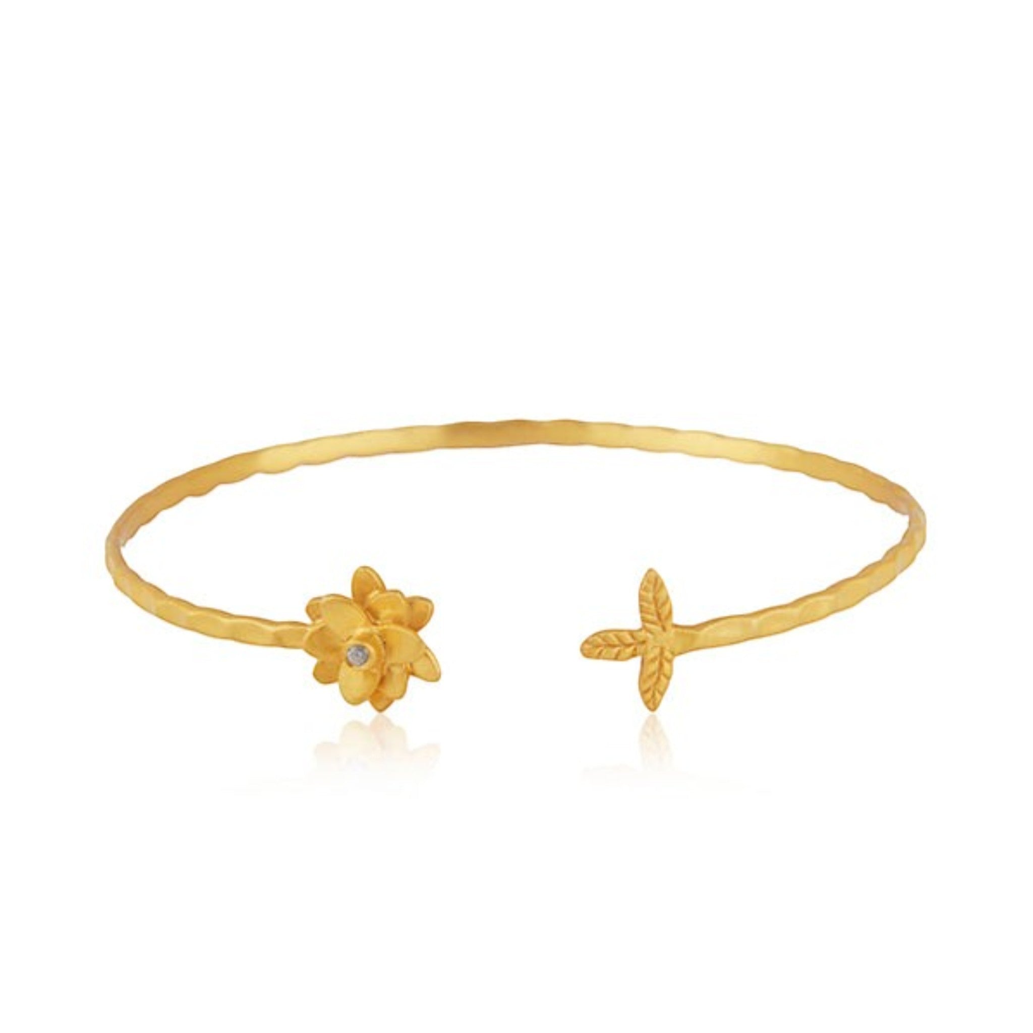 Tania Claire Australia Petal Thorn Cuff, hammered gold cuff bracelet with a floral design, a single crystal, and a leaf accent.